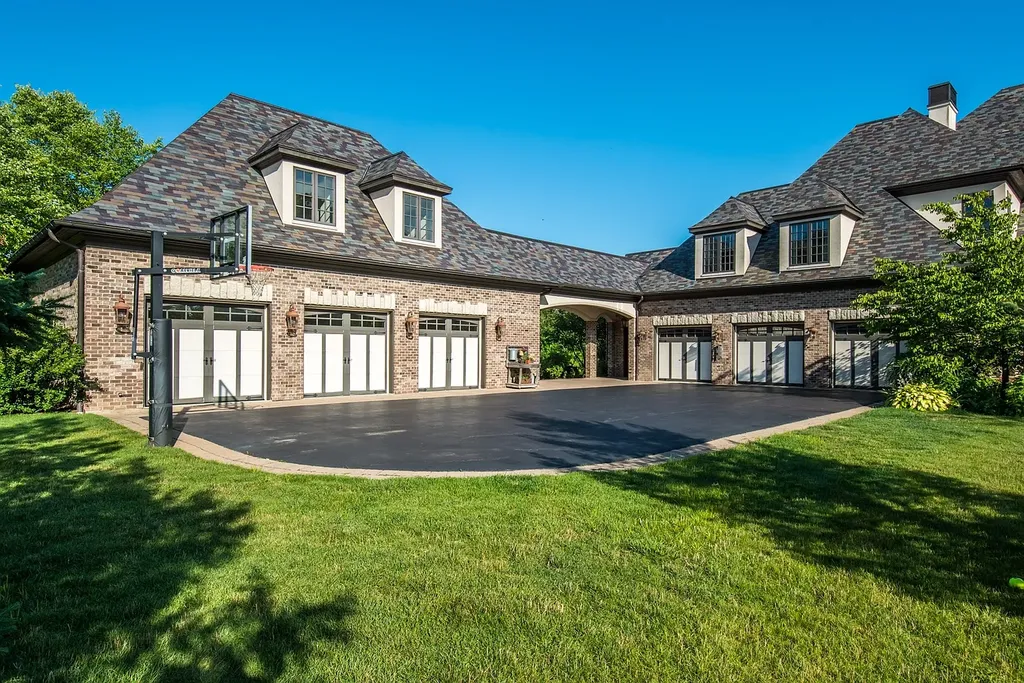 2 Rock Ridge Road Home in Barrington, Illinois. Discover the beauty of this one-of-a-kind estate in Barrington Hills, situated on 12.3 acres of picturesque land. This stunning home showcases expert craftsmanship, finest materials, and luxurious amenities. 