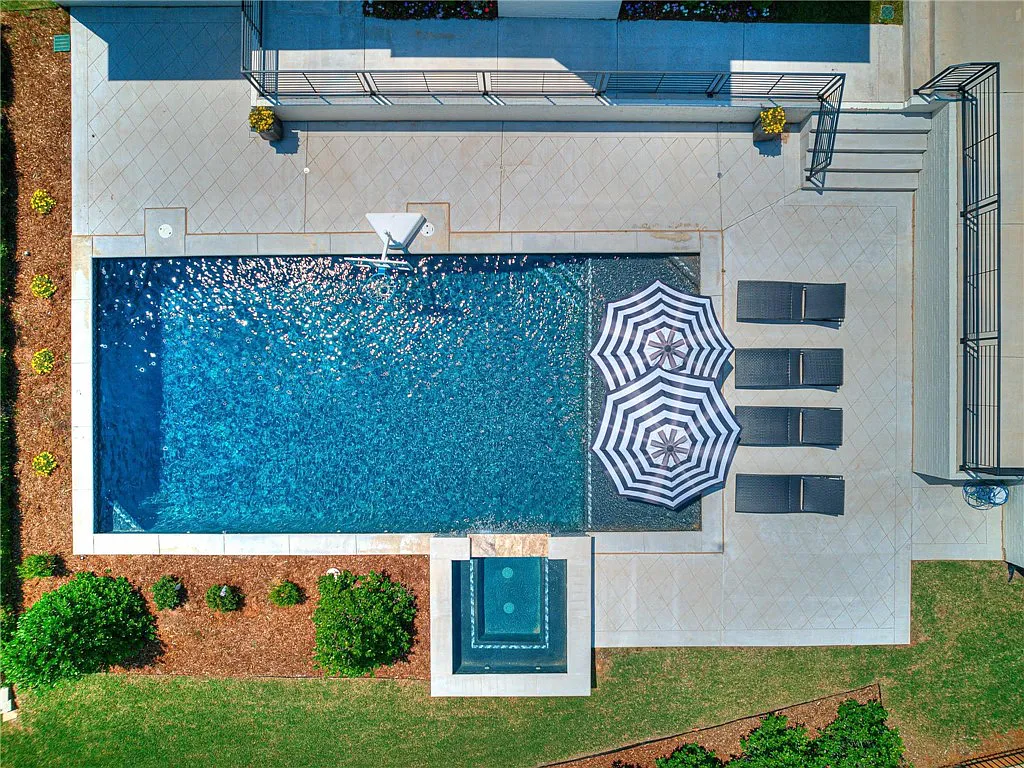 3108 Blackstone Drive Home in Edmond, Oklahoma. Welcome to your dream oasis! Prepare to be captivated by this extraordinary home, encompassing over 7,300 square feet of unparalleled luxury and exquisite designer finishes. Every detail has been meticulously crafted to create a space that will leave you in awe.