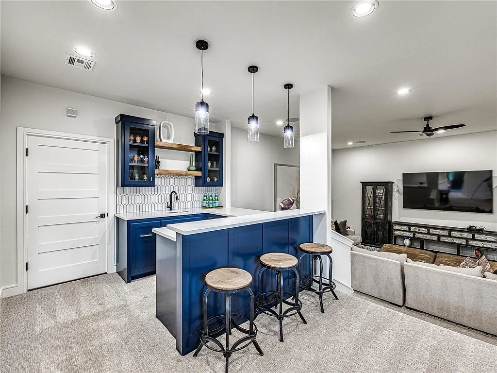 3108 Blackstone Drive Home in Edmond, Oklahoma. Welcome to your dream oasis! Prepare to be captivated by this extraordinary home, encompassing over 7,300 square feet of unparalleled luxury and exquisite designer finishes. Every detail has been meticulously crafted to create a space that will leave you in awe.