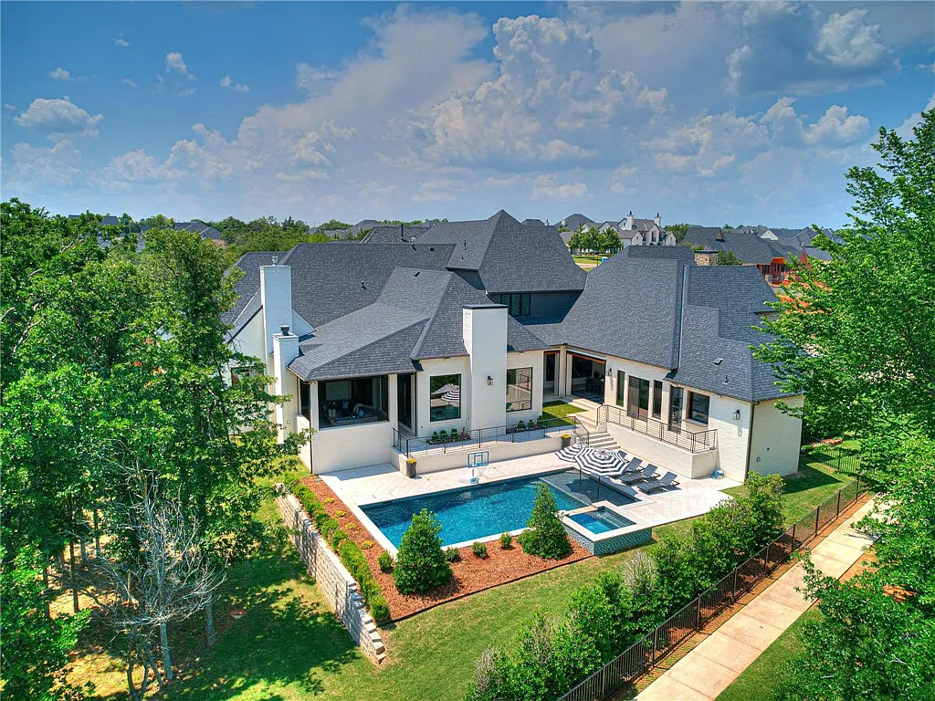 3108 Blackstone Drive Home in Edmond, Oklahoma. Welcome to your dream oasis! Prepare to be captivated by this extraordinary home, encompassing over 7,300 square feet of unparalleled luxury and exquisite designer finishes. Every detail has been meticulously crafted to create a space that will leave you in awe.