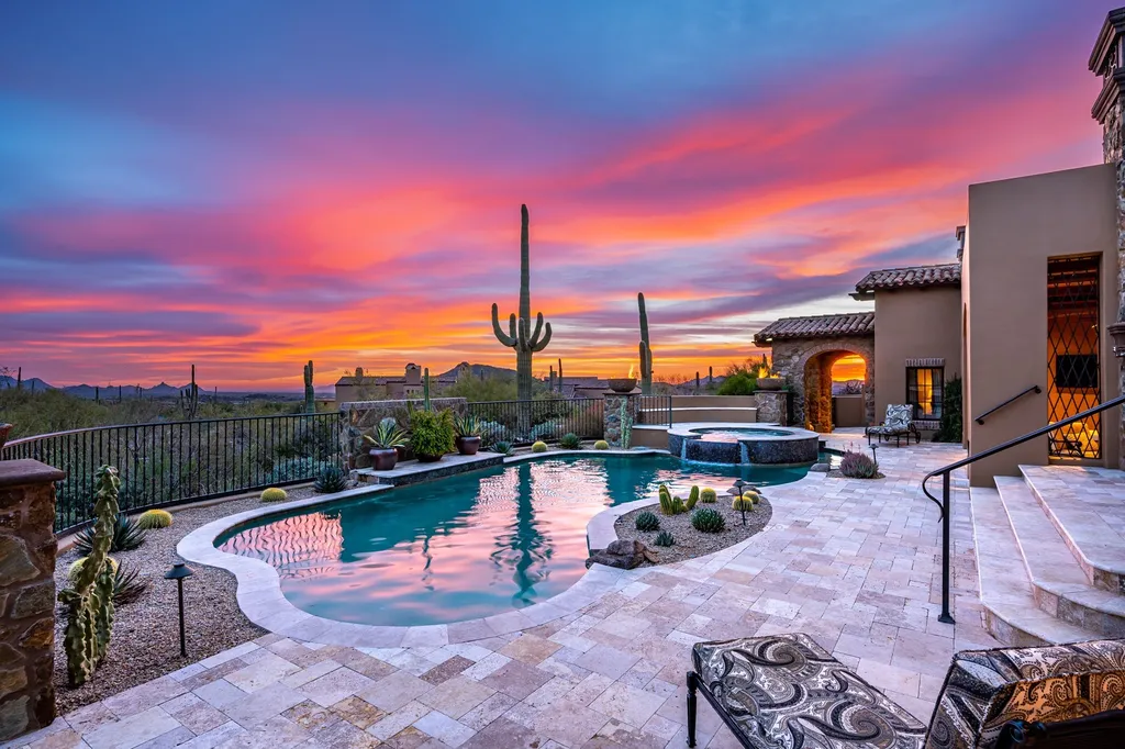 41781 N 99th Way Home in Scottsdale, Arizona. Explore this splendid Old World estate with GOLF Membership available, showcasing warmth, comfort, and unparalleled quality. From the intricately designed interiors to the resort-style patio and serene view terrace, every detail exudes thoughtful craftsmanship and fine materials. 