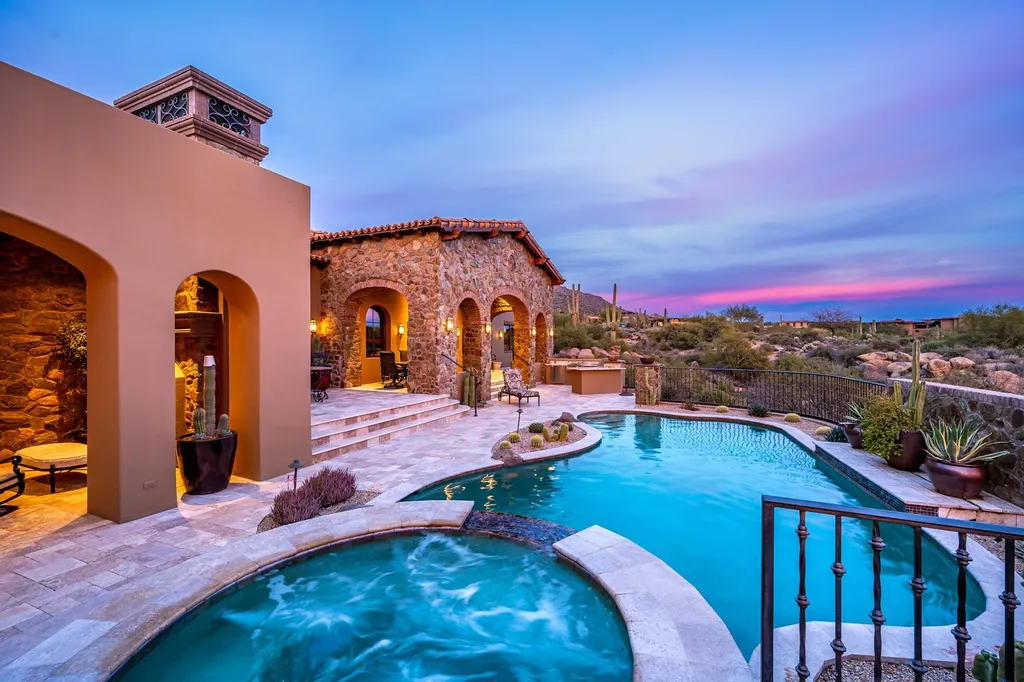 41781 N 99th Way Home in Scottsdale, Arizona. Explore this splendid Old World estate with GOLF Membership available, showcasing warmth, comfort, and unparalleled quality. From the intricately designed interiors to the resort-style patio and serene view terrace, every detail exudes thoughtful craftsmanship and fine materials. 