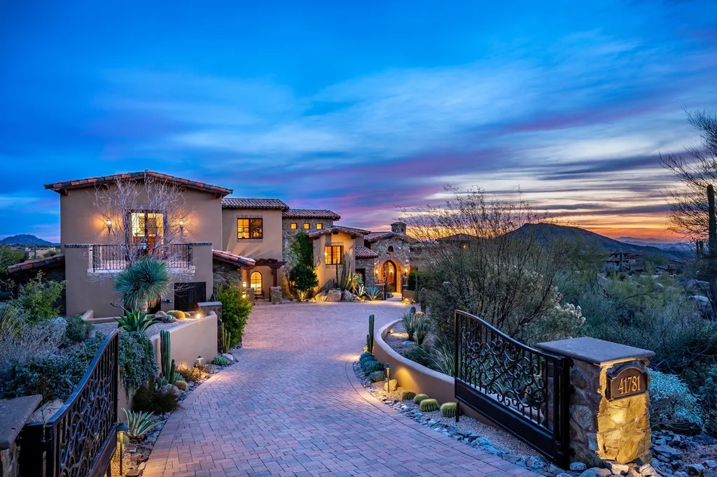 41781 N 99th Way Home in Scottsdale, Arizona. Explore this splendid Old World estate with GOLF Membership available, showcasing warmth, comfort, and unparalleled quality. From the intricately designed interiors to the resort-style patio and serene view terrace, every detail exudes thoughtful craftsmanship and fine materials. 