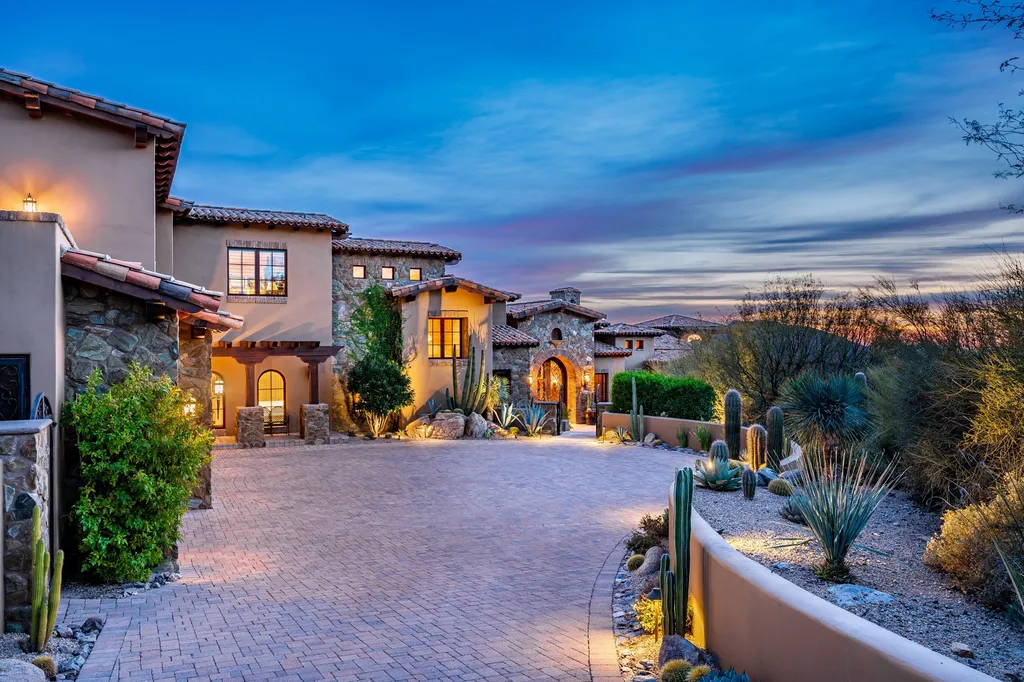 41781 N 99th Way Home in Scottsdale, Arizona. Explore this splendid Old World estate with GOLF Membership available, showcasing warmth, comfort, and unparalleled quality. From the intricately designed interiors to the resort-style patio and serene view terrace, every detail exudes thoughtful craftsmanship and fine materials. 