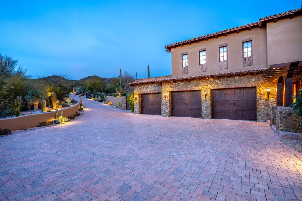 41781 N 99th Way Home in Scottsdale, Arizona. Explore this splendid Old World estate with GOLF Membership available, showcasing warmth, comfort, and unparalleled quality. From the intricately designed interiors to the resort-style patio and serene view terrace, every detail exudes thoughtful craftsmanship and fine materials. 