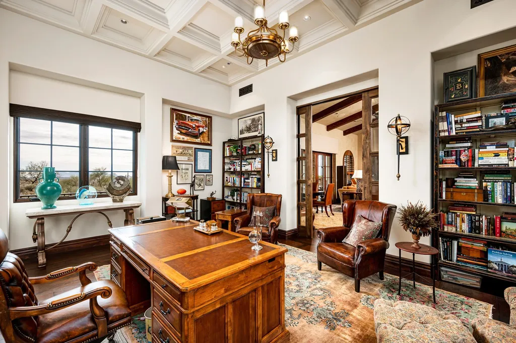 41781 N 99th Way Home in Scottsdale, Arizona. Explore this splendid Old World estate with GOLF Membership available, showcasing warmth, comfort, and unparalleled quality. From the intricately designed interiors to the resort-style patio and serene view terrace, every detail exudes thoughtful craftsmanship and fine materials. 
