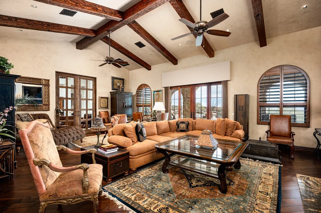 41781 N 99th Way Home in Scottsdale, Arizona. Explore this splendid Old World estate with GOLF Membership available, showcasing warmth, comfort, and unparalleled quality. From the intricately designed interiors to the resort-style patio and serene view terrace, every detail exudes thoughtful craftsmanship and fine materials. 