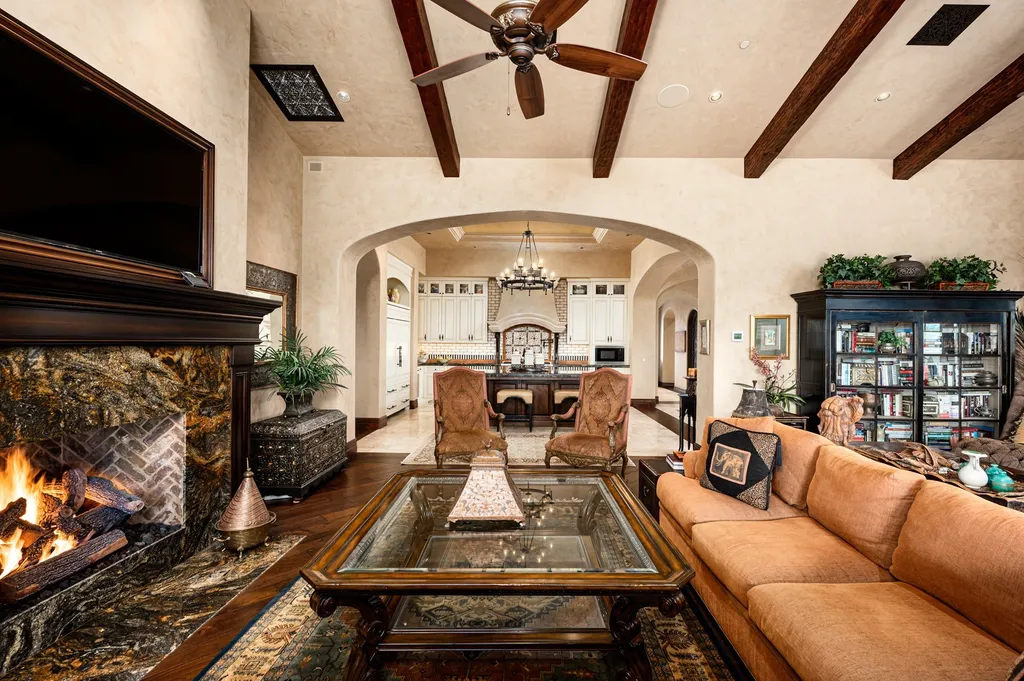 41781 N 99th Way Home in Scottsdale, Arizona. Explore this splendid Old World estate with GOLF Membership available, showcasing warmth, comfort, and unparalleled quality. From the intricately designed interiors to the resort-style patio and serene view terrace, every detail exudes thoughtful craftsmanship and fine materials. 