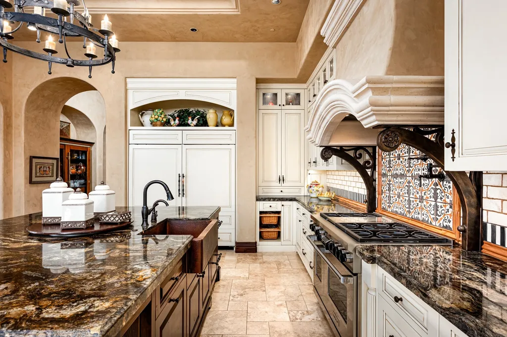 41781 N 99th Way Home in Scottsdale, Arizona. Explore this splendid Old World estate with GOLF Membership available, showcasing warmth, comfort, and unparalleled quality. From the intricately designed interiors to the resort-style patio and serene view terrace, every detail exudes thoughtful craftsmanship and fine materials. 