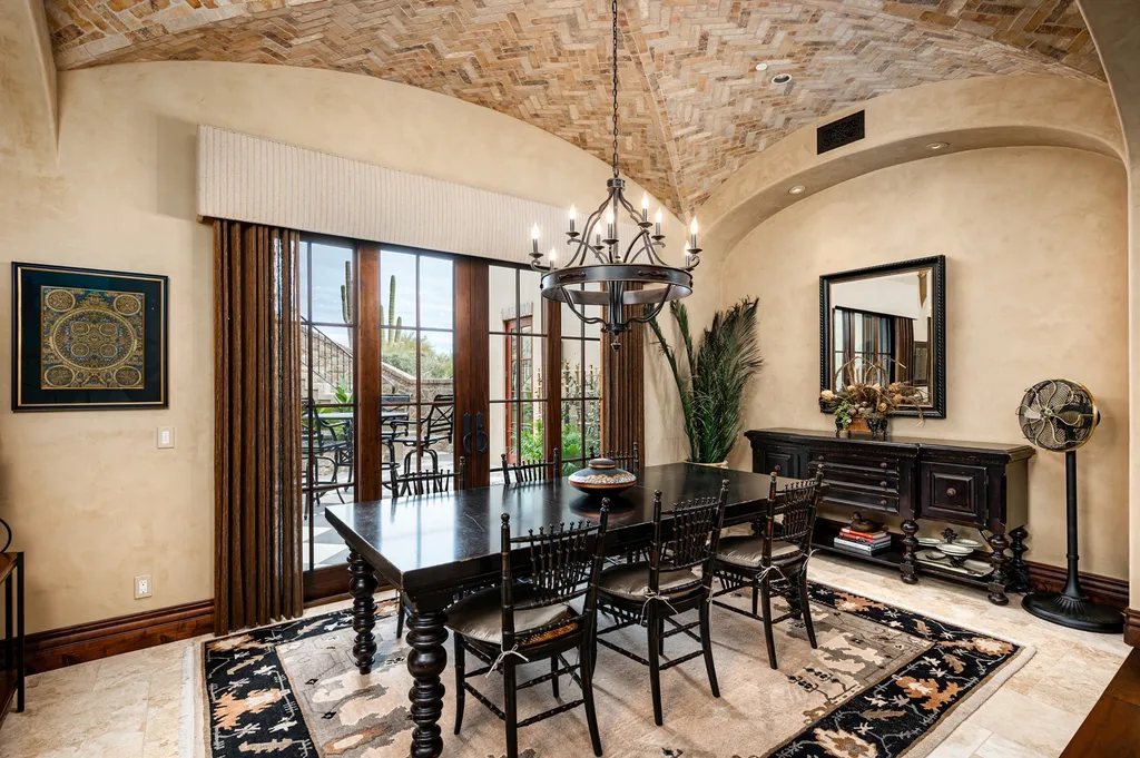 41781 N 99th Way Home in Scottsdale, Arizona. Explore this splendid Old World estate with GOLF Membership available, showcasing warmth, comfort, and unparalleled quality. From the intricately designed interiors to the resort-style patio and serene view terrace, every detail exudes thoughtful craftsmanship and fine materials. 