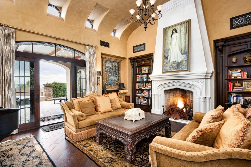 41781 N 99th Way Home in Scottsdale, Arizona. Explore this splendid Old World estate with GOLF Membership available, showcasing warmth, comfort, and unparalleled quality. From the intricately designed interiors to the resort-style patio and serene view terrace, every detail exudes thoughtful craftsmanship and fine materials. 