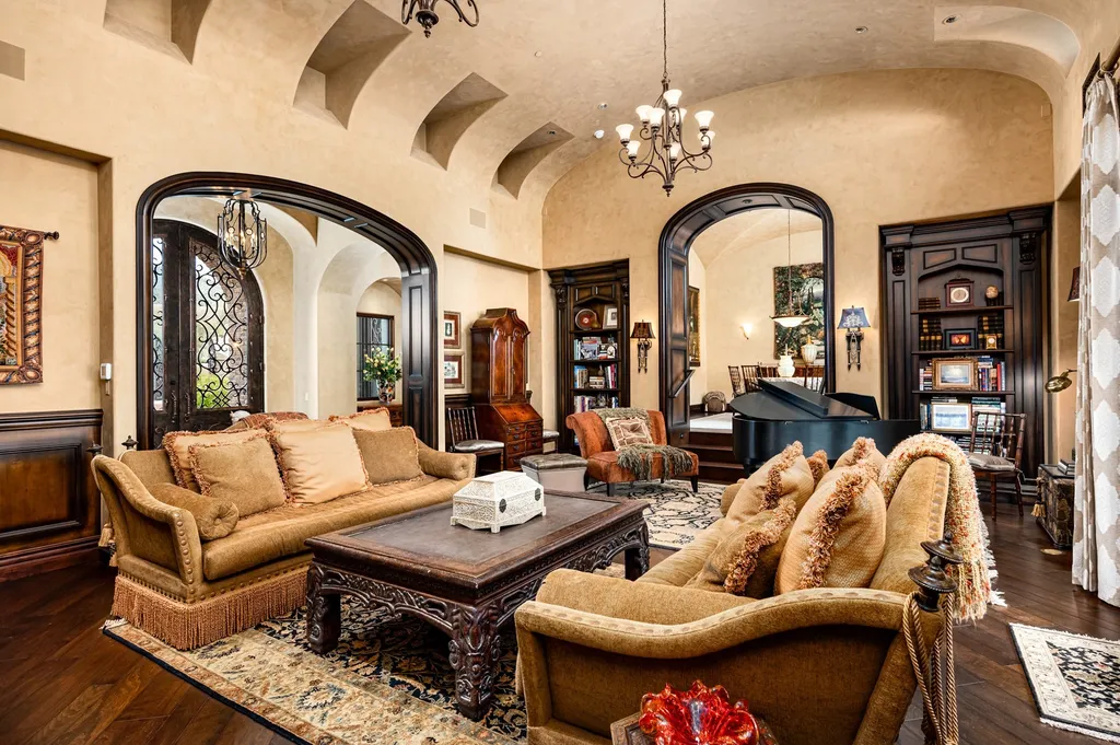 41781 N 99th Way Home in Scottsdale, Arizona. Explore this splendid Old World estate with GOLF Membership available, showcasing warmth, comfort, and unparalleled quality. From the intricately designed interiors to the resort-style patio and serene view terrace, every detail exudes thoughtful craftsmanship and fine materials. 