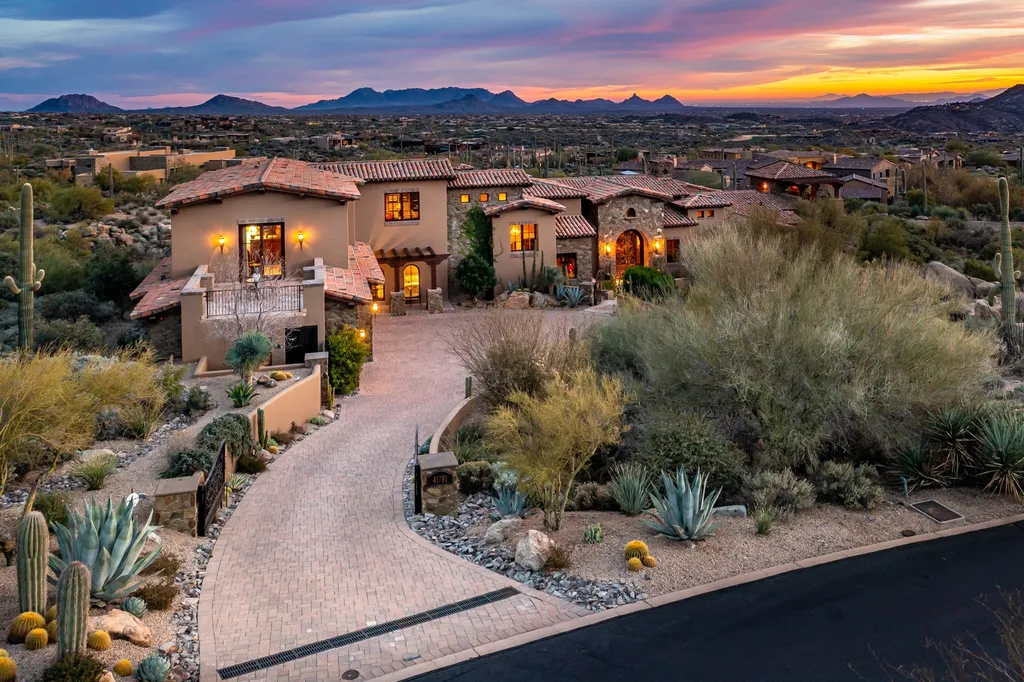 41781 N 99th Way Home in Scottsdale, Arizona. Explore this splendid Old World estate with GOLF Membership available, showcasing warmth, comfort, and unparalleled quality. From the intricately designed interiors to the resort-style patio and serene view terrace, every detail exudes thoughtful craftsmanship and fine materials. 