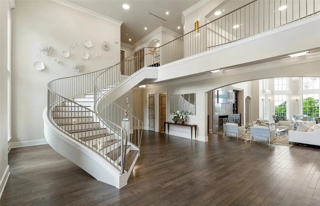 5862 North Eagle Summit Road Home in Owasso, Oklahoma. Step into luxury with this exceptional mansion in the prestigious Bluffs at Stone Canyon. Featuring a grand entry foyer, artistic half baths, a spacious Great Room with a fireplace, and a stunning Master Suite offering breathtaking views and a luxurious spa bath, this home epitomizes elegance. Enjoy the convenience of multiple laundry rooms, a gourmet kitchen with high-end appliances, two Executive Office Suites, a game room with a wet bar and theater room, and three additional bedrooms with private baths.