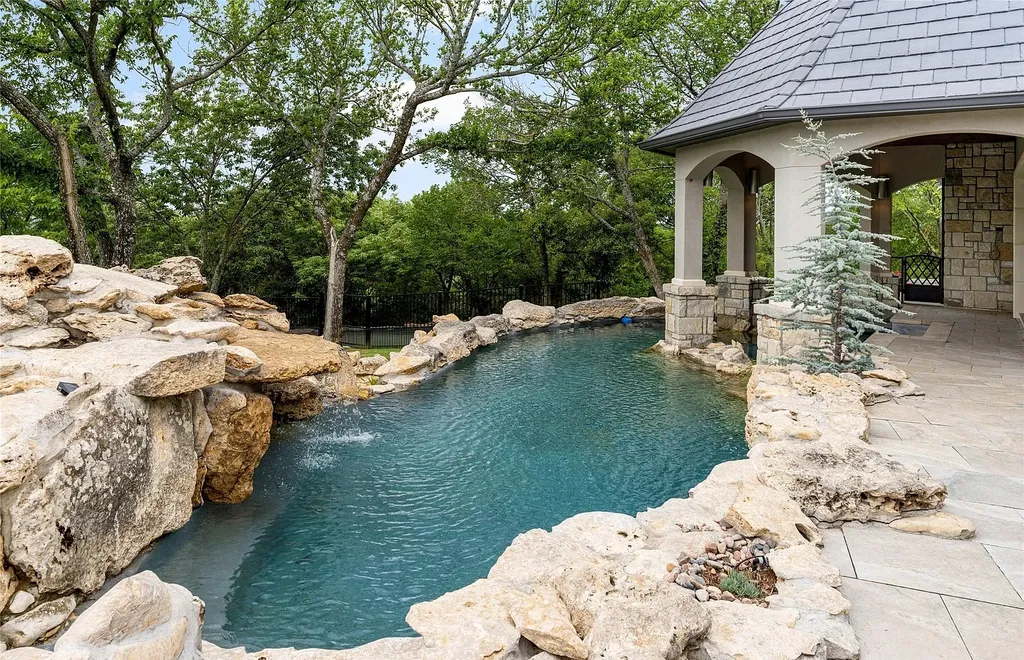 5862 North Eagle Summit Road Home in Owasso, Oklahoma. Step into luxury with this exceptional mansion in the prestigious Bluffs at Stone Canyon. Featuring a grand entry foyer, artistic half baths, a spacious Great Room with a fireplace, and a stunning Master Suite offering breathtaking views and a luxurious spa bath, this home epitomizes elegance. Enjoy the convenience of multiple laundry rooms, a gourmet kitchen with high-end appliances, two Executive Office Suites, a game room with a wet bar and theater room, and three additional bedrooms with private baths.