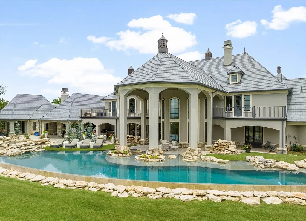 5862 North Eagle Summit Road Home in Owasso, Oklahoma. Step into luxury with this exceptional mansion in the prestigious Bluffs at Stone Canyon. Featuring a grand entry foyer, artistic half baths, a spacious Great Room with a fireplace, and a stunning Master Suite offering breathtaking views and a luxurious spa bath, this home epitomizes elegance. Enjoy the convenience of multiple laundry rooms, a gourmet kitchen with high-end appliances, two Executive Office Suites, a game room with a wet bar and theater room, and three additional bedrooms with private baths.