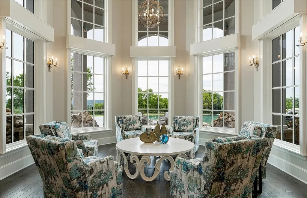 5862 North Eagle Summit Road Home in Owasso, Oklahoma. Step into luxury with this exceptional mansion in the prestigious Bluffs at Stone Canyon. Featuring a grand entry foyer, artistic half baths, a spacious Great Room with a fireplace, and a stunning Master Suite offering breathtaking views and a luxurious spa bath, this home epitomizes elegance. Enjoy the convenience of multiple laundry rooms, a gourmet kitchen with high-end appliances, two Executive Office Suites, a game room with a wet bar and theater room, and three additional bedrooms with private baths.