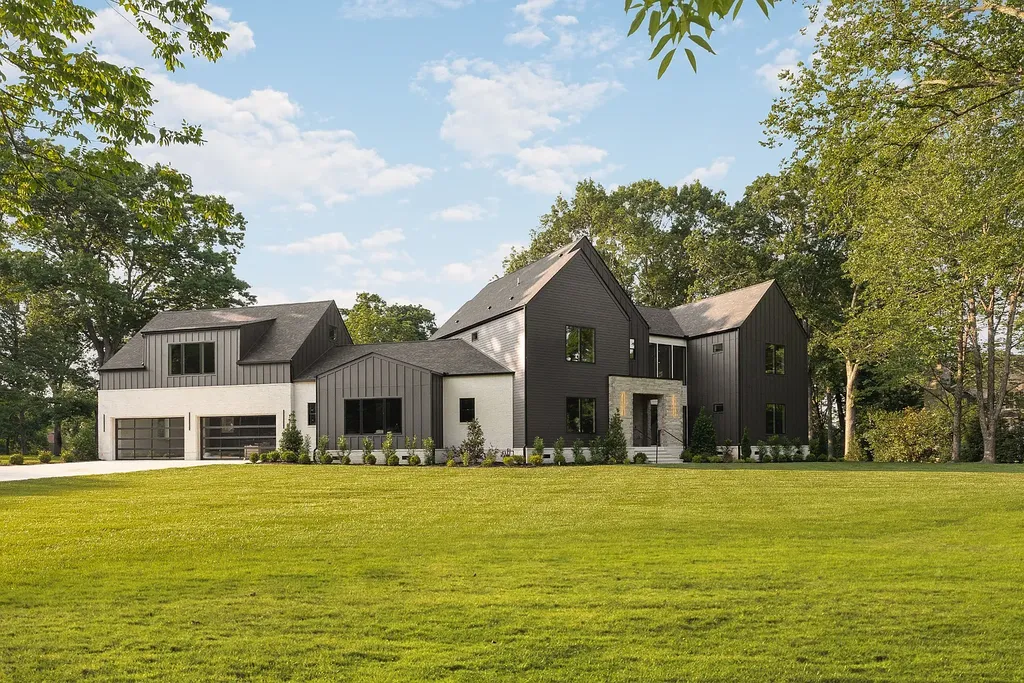 6240 Bresslyn Road Home in Nashville, Tennessee. Province Builders LLC & Laura Greene Interiors have created a stunning contemporary masterpiece on a spacious one-acre lot in the desirable West Meade neighborhood. This home showcases impeccable attention to detail and a tasteful blend of sophistication and modernity. 
