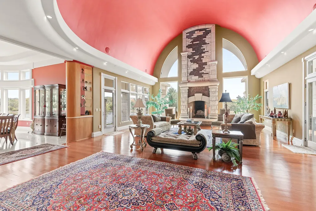 6800 S Lakota Ridge Lane Home in Columbia, Missouri. Discover the epitome of luxury living in this one-of-a-kind 11,000 square foot estate in southern Columbia. Boasting imported Israeli stone, soaring 28-foot ceilings, alabaster light fixtures, heated floors, and a stunning 30-foot waterfall, this home is truly extraordinary. 