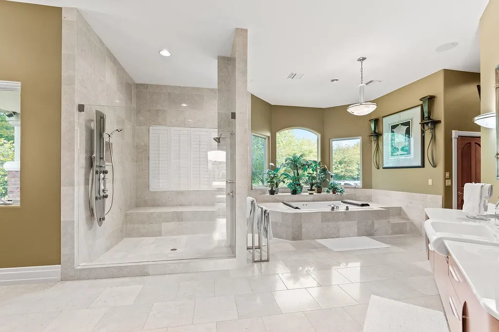 6800 S Lakota Ridge Lane Home in Columbia, Missouri. Discover the epitome of luxury living in this one-of-a-kind 11,000 square foot estate in southern Columbia. Boasting imported Israeli stone, soaring 28-foot ceilings, alabaster light fixtures, heated floors, and a stunning 30-foot waterfall, this home is truly extraordinary. 