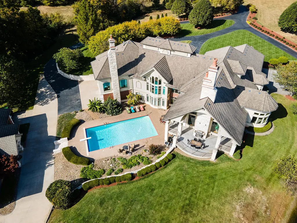 6800 S Lakota Ridge Lane Home in Columbia, Missouri. Discover the epitome of luxury living in this one-of-a-kind 11,000 square foot estate in southern Columbia. Boasting imported Israeli stone, soaring 28-foot ceilings, alabaster light fixtures, heated floors, and a stunning 30-foot waterfall, this home is truly extraordinary. 
