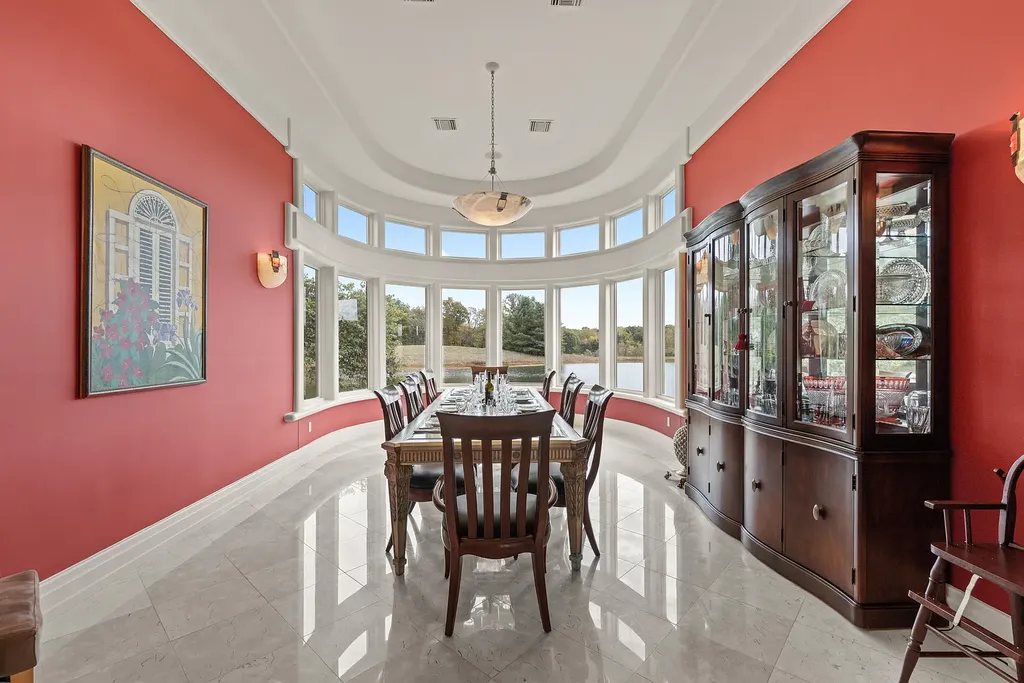 6800 S Lakota Ridge Lane Home in Columbia, Missouri. Discover the epitome of luxury living in this one-of-a-kind 11,000 square foot estate in southern Columbia. Boasting imported Israeli stone, soaring 28-foot ceilings, alabaster light fixtures, heated floors, and a stunning 30-foot waterfall, this home is truly extraordinary. 