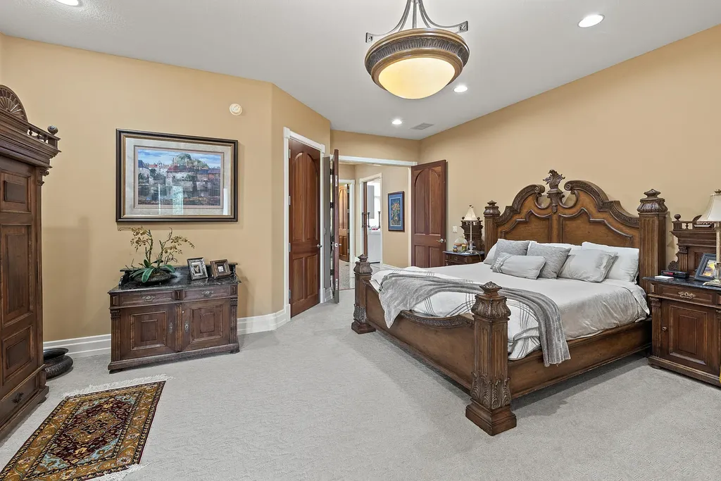 6800 S Lakota Ridge Lane Home in Columbia, Missouri. Discover the epitome of luxury living in this one-of-a-kind 11,000 square foot estate in southern Columbia. Boasting imported Israeli stone, soaring 28-foot ceilings, alabaster light fixtures, heated floors, and a stunning 30-foot waterfall, this home is truly extraordinary. 