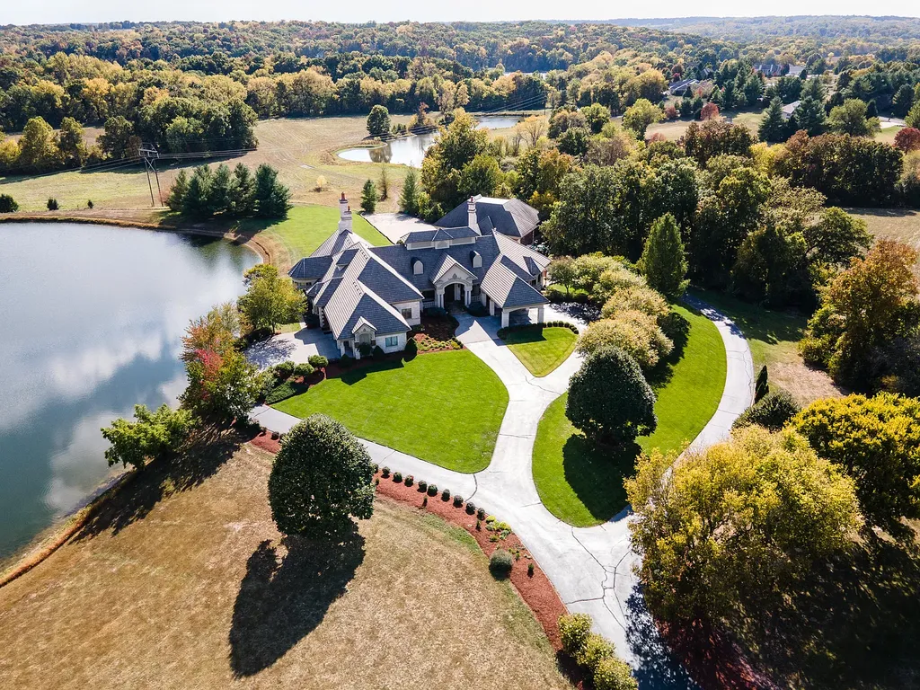 6800 S Lakota Ridge Lane Home in Columbia, Missouri. Discover the epitome of luxury living in this one-of-a-kind 11,000 square foot estate in southern Columbia. Boasting imported Israeli stone, soaring 28-foot ceilings, alabaster light fixtures, heated floors, and a stunning 30-foot waterfall, this home is truly extraordinary. 