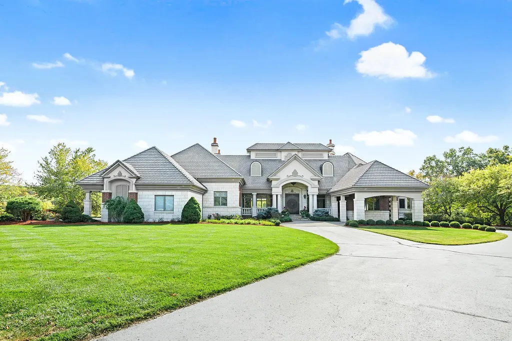 6800 S Lakota Ridge Lane Home in Columbia, Missouri. Discover the epitome of luxury living in this one-of-a-kind 11,000 square foot estate in southern Columbia. Boasting imported Israeli stone, soaring 28-foot ceilings, alabaster light fixtures, heated floors, and a stunning 30-foot waterfall, this home is truly extraordinary. 