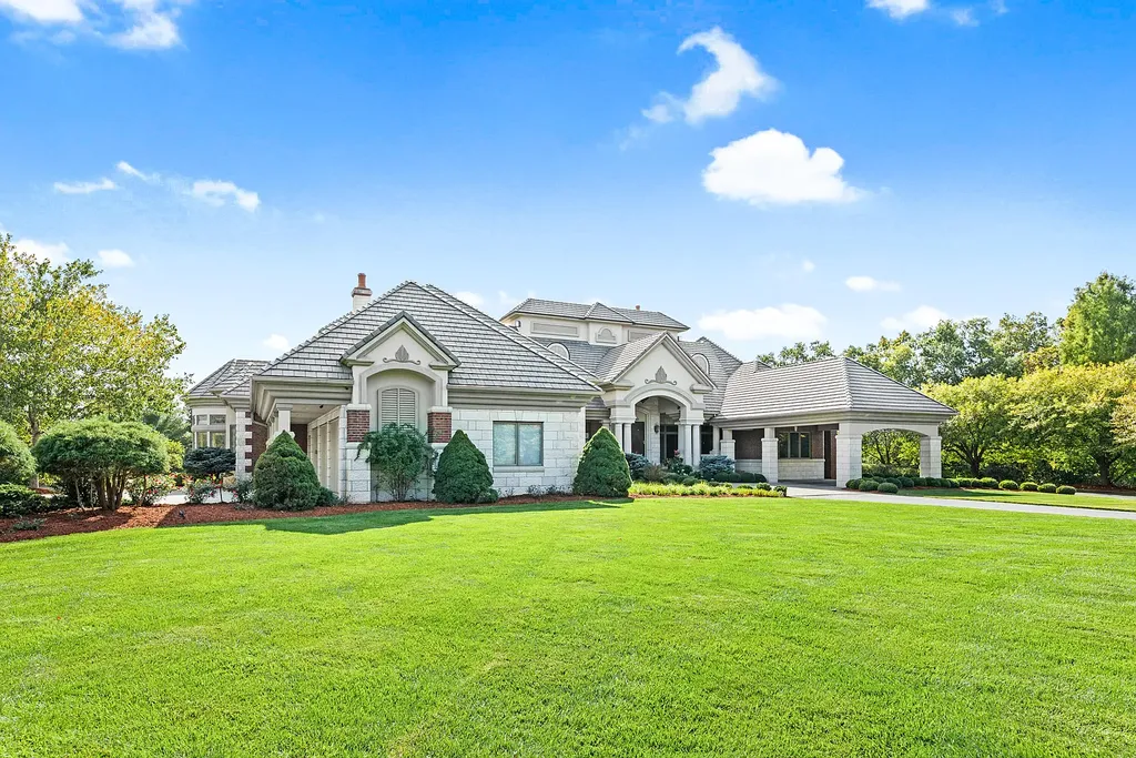 6800 S Lakota Ridge Lane Home in Columbia, Missouri. Discover the epitome of luxury living in this one-of-a-kind 11,000 square foot estate in southern Columbia. Boasting imported Israeli stone, soaring 28-foot ceilings, alabaster light fixtures, heated floors, and a stunning 30-foot waterfall, this home is truly extraordinary. 