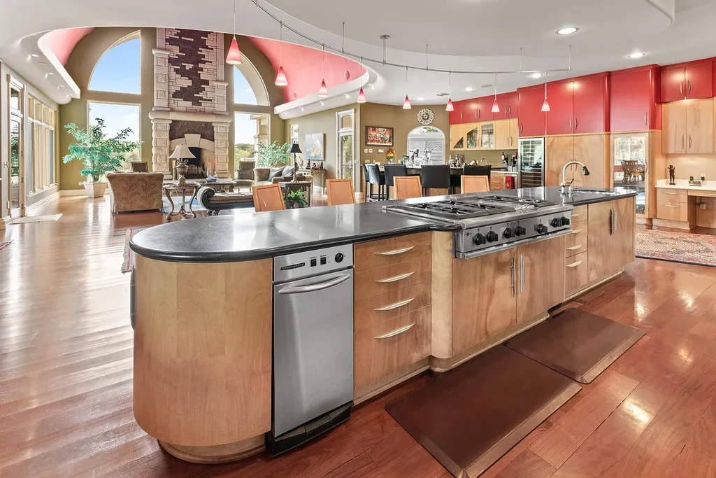 6800 S Lakota Ridge Lane Home in Columbia, Missouri. Discover the epitome of luxury living in this one-of-a-kind 11,000 square foot estate in southern Columbia. Boasting imported Israeli stone, soaring 28-foot ceilings, alabaster light fixtures, heated floors, and a stunning 30-foot waterfall, this home is truly extraordinary. 