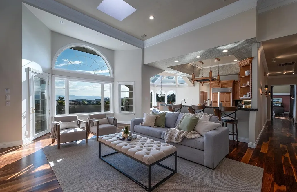 Discover the exquisite luxury of Eagle's Nest, a unique and meticulously designed estate in the prestigious gated community. Enjoy panoramic views, soaring ceilings, and a perfect blend of modern comfort and timeless elegance. This magnificent property features a chef's kitchen, a wine cellar, a resort-style pool area, and much more. 