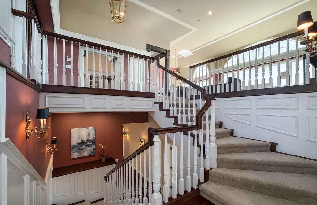 Discover the exquisite luxury of Eagle's Nest, a unique and meticulously designed estate in the prestigious gated community. Enjoy panoramic views, soaring ceilings, and a perfect blend of modern comfort and timeless elegance. This magnificent property features a chef's kitchen, a wine cellar, a resort-style pool area, and much more. 