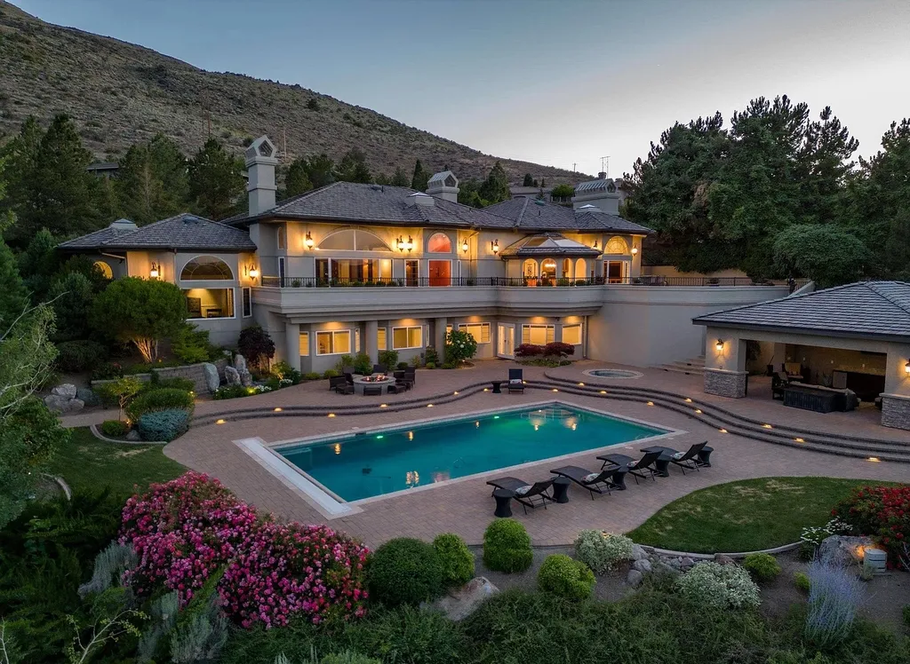 Discover the exquisite luxury of Eagle's Nest, a unique and meticulously designed estate in the prestigious gated community. Enjoy panoramic views, soaring ceilings, and a perfect blend of modern comfort and timeless elegance. This magnificent property features a chef's kitchen, a wine cellar, a resort-style pool area, and much more. 