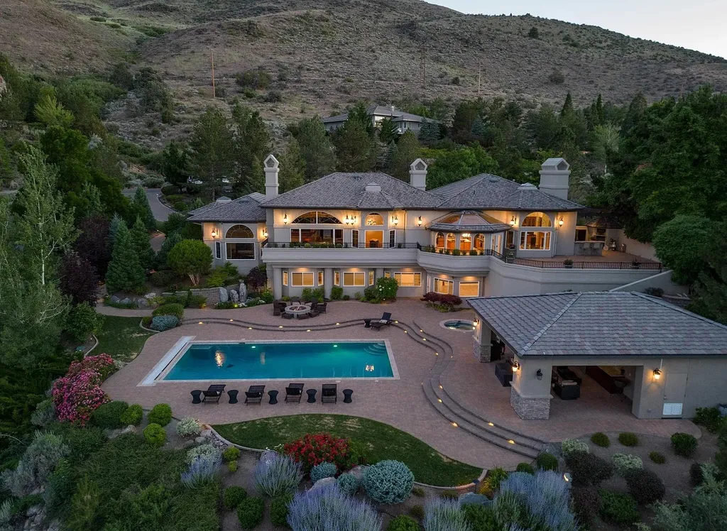 Discover the exquisite luxury of Eagle's Nest, a unique and meticulously designed estate in the prestigious gated community. Enjoy panoramic views, soaring ceilings, and a perfect blend of modern comfort and timeless elegance. This magnificent property features a chef's kitchen, a wine cellar, a resort-style pool area, and much more. 