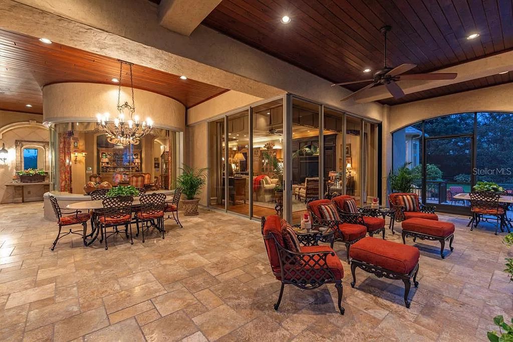 Discover elegance and luxury at 5200 Isleworth Country Club Drive in Windermere, Florida. This magnificent 5-bed, 8-bath estate with 9,482 sq ft of living space is situated on the eighth fairway of the Isleworth Golf and Country Club golf course, offering breathtaking views of Lake Bessie