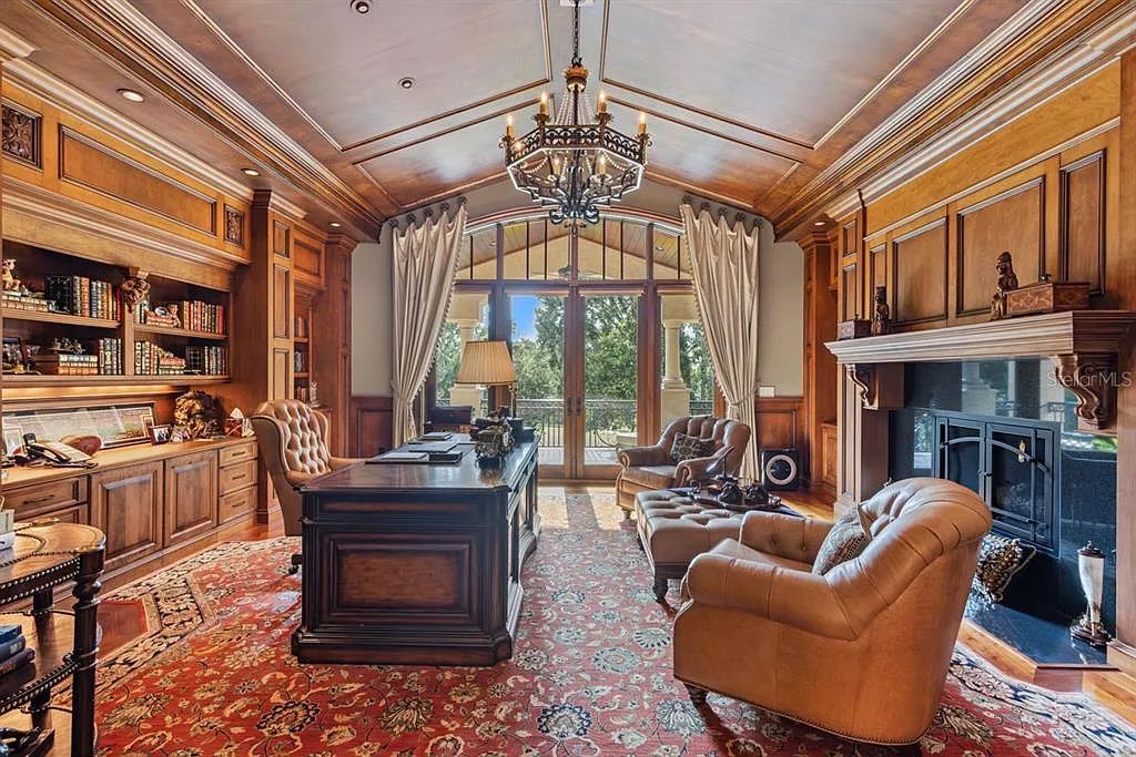 Discover elegance and luxury at 5200 Isleworth Country Club Drive in Windermere, Florida. This magnificent 5-bed, 8-bath estate with 9,482 sq ft of living space is situated on the eighth fairway of the Isleworth Golf and Country Club golf course, offering breathtaking views of Lake Bessie