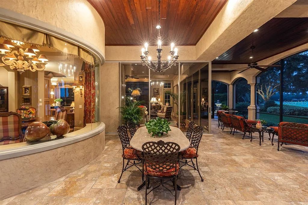 Discover elegance and luxury at 5200 Isleworth Country Club Drive in Windermere, Florida. This magnificent 5-bed, 8-bath estate with 9,482 sq ft of living space is situated on the eighth fairway of the Isleworth Golf and Country Club golf course, offering breathtaking views of Lake Bessie