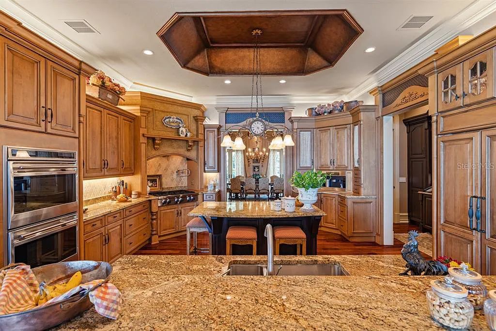 Discover elegance and luxury at 5200 Isleworth Country Club Drive in Windermere, Florida. This magnificent 5-bed, 8-bath estate with 9,482 sq ft of living space is situated on the eighth fairway of the Isleworth Golf and Country Club golf course, offering breathtaking views of Lake Bessie