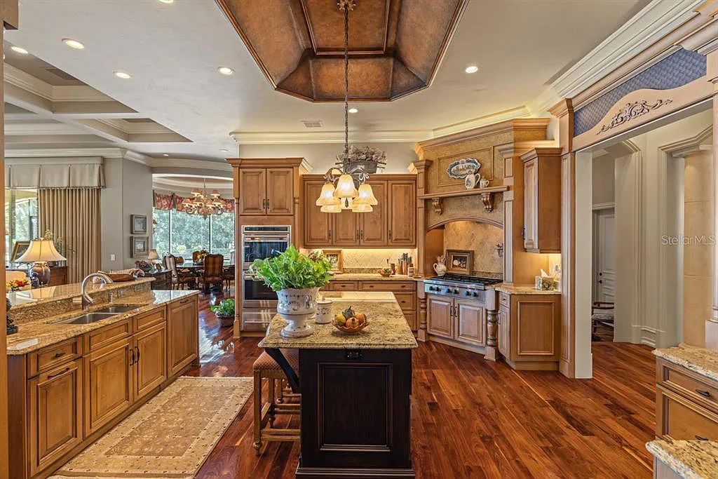 Discover elegance and luxury at 5200 Isleworth Country Club Drive in Windermere, Florida. This magnificent 5-bed, 8-bath estate with 9,482 sq ft of living space is situated on the eighth fairway of the Isleworth Golf and Country Club golf course, offering breathtaking views of Lake Bessie