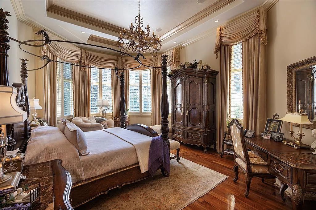 Discover elegance and luxury at 5200 Isleworth Country Club Drive in Windermere, Florida. This magnificent 5-bed, 8-bath estate with 9,482 sq ft of living space is situated on the eighth fairway of the Isleworth Golf and Country Club golf course, offering breathtaking views of Lake Bessie