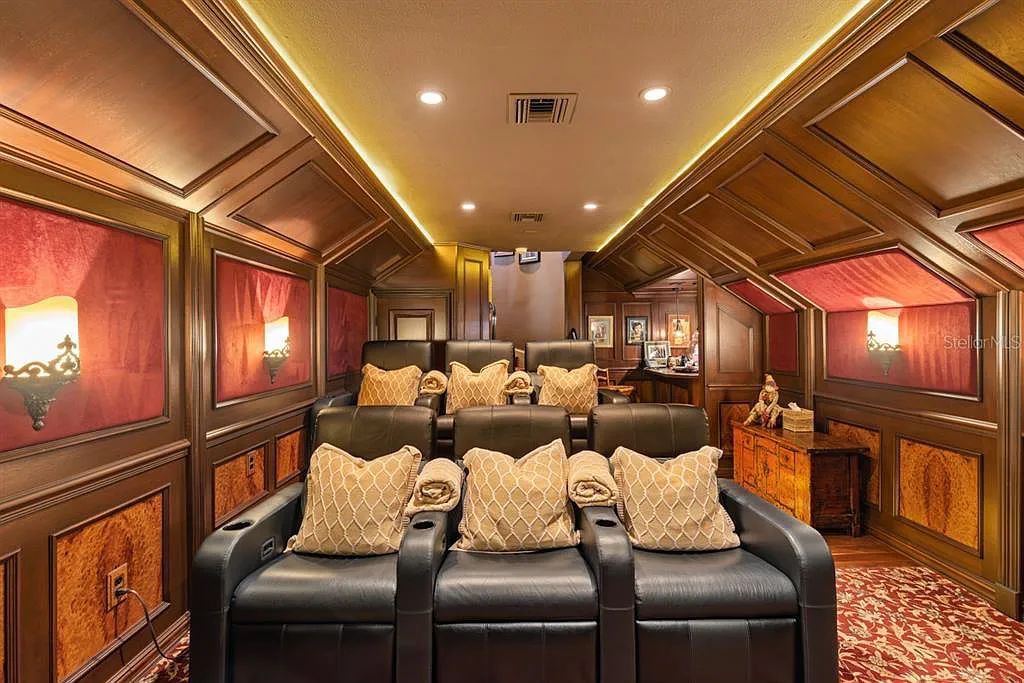 Discover elegance and luxury at 5200 Isleworth Country Club Drive in Windermere, Florida. This magnificent 5-bed, 8-bath estate with 9,482 sq ft of living space is situated on the eighth fairway of the Isleworth Golf and Country Club golf course, offering breathtaking views of Lake Bessie