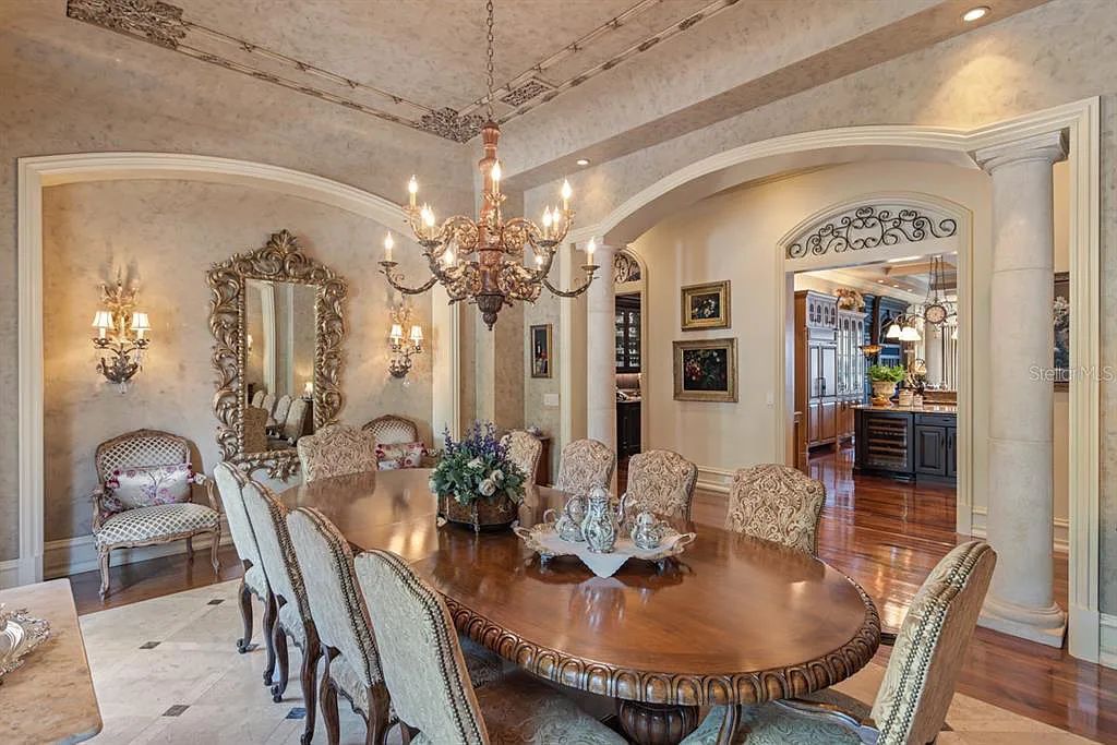 Discover elegance and luxury at 5200 Isleworth Country Club Drive in Windermere, Florida. This magnificent 5-bed, 8-bath estate with 9,482 sq ft of living space is situated on the eighth fairway of the Isleworth Golf and Country Club golf course, offering breathtaking views of Lake Bessie