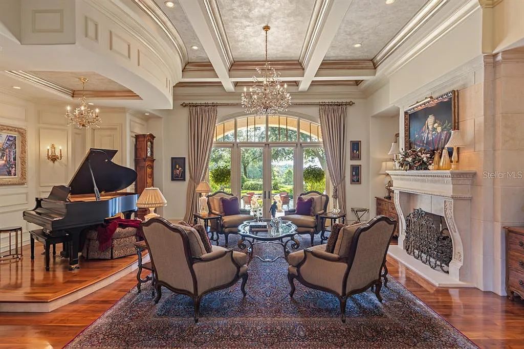 Discover elegance and luxury at 5200 Isleworth Country Club Drive in Windermere, Florida. This magnificent 5-bed, 8-bath estate with 9,482 sq ft of living space is situated on the eighth fairway of the Isleworth Golf and Country Club golf course, offering breathtaking views of Lake Bessie