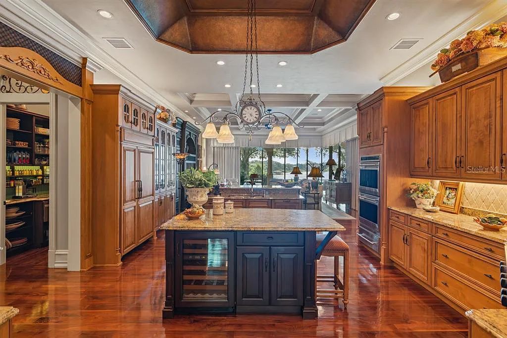 Discover elegance and luxury at 5200 Isleworth Country Club Drive in Windermere, Florida. This magnificent 5-bed, 8-bath estate with 9,482 sq ft of living space is situated on the eighth fairway of the Isleworth Golf and Country Club golf course, offering breathtaking views of Lake Bessie