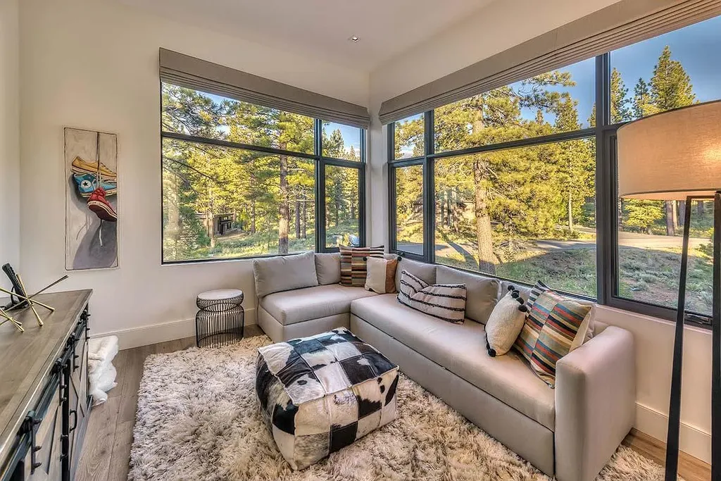 9601 Dunsmuir Way Home in Truckee, California. Immerse yourself in the tranquility of this exquisite Martis Camp home, boasting panoramic mountain views and luxurious amenities. Wake up to breathtaking sunrises, enjoy the open great room with its stunning architecture, and indulge in the state-of-the-art kitchen and spacious living areas. With five bedrooms, a hot tub patio, and proximity to skiing and tennis facilities, this retreat offers a perfect balance of serenity and convenience. Experience mountain living at its finest in this stylishly designed home nestled amidst the natural beauty of Martis Camp.