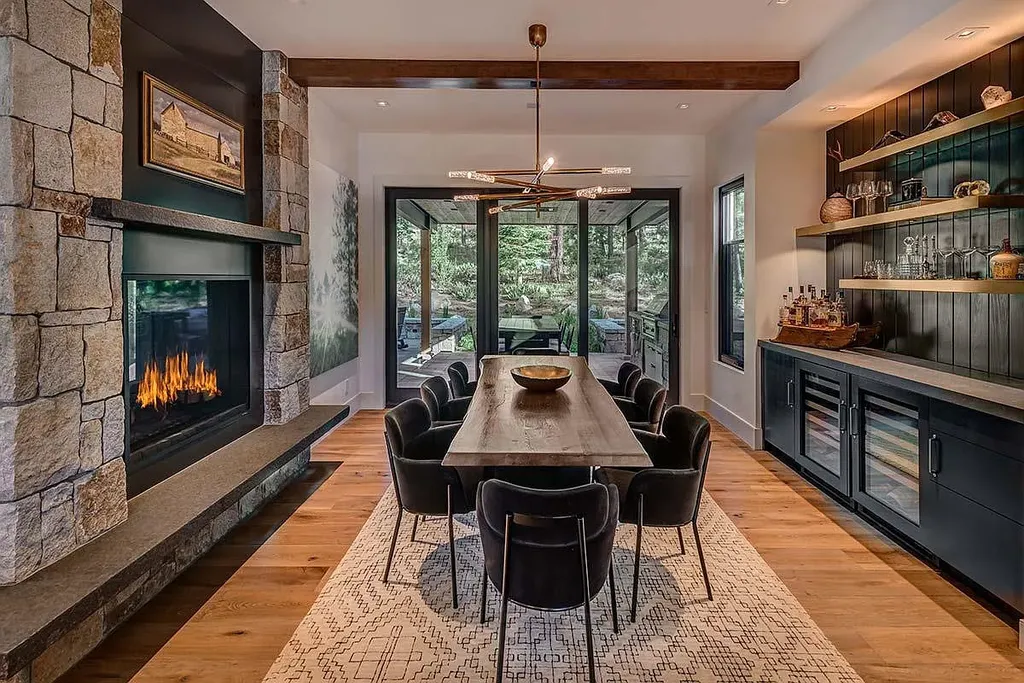 9601 Dunsmuir Way Home in Truckee, California. Immerse yourself in the tranquility of this exquisite Martis Camp home, boasting panoramic mountain views and luxurious amenities. Wake up to breathtaking sunrises, enjoy the open great room with its stunning architecture, and indulge in the state-of-the-art kitchen and spacious living areas. With five bedrooms, a hot tub patio, and proximity to skiing and tennis facilities, this retreat offers a perfect balance of serenity and convenience. Experience mountain living at its finest in this stylishly designed home nestled amidst the natural beauty of Martis Camp.