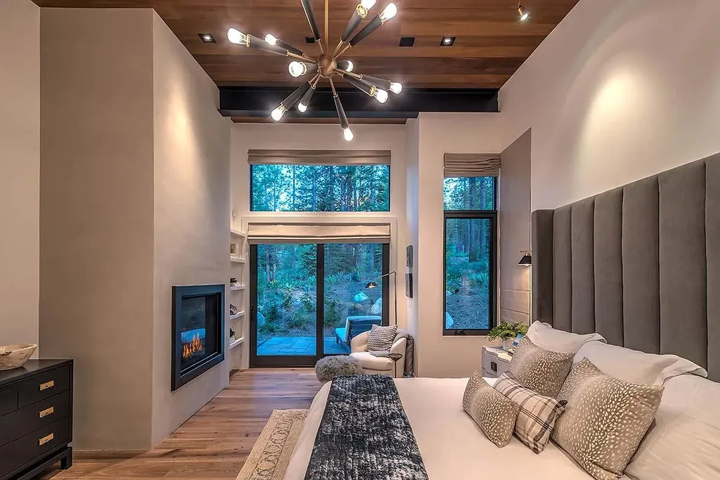 9601 Dunsmuir Way Home in Truckee, California. Immerse yourself in the tranquility of this exquisite Martis Camp home, boasting panoramic mountain views and luxurious amenities. Wake up to breathtaking sunrises, enjoy the open great room with its stunning architecture, and indulge in the state-of-the-art kitchen and spacious living areas. With five bedrooms, a hot tub patio, and proximity to skiing and tennis facilities, this retreat offers a perfect balance of serenity and convenience. Experience mountain living at its finest in this stylishly designed home nestled amidst the natural beauty of Martis Camp.