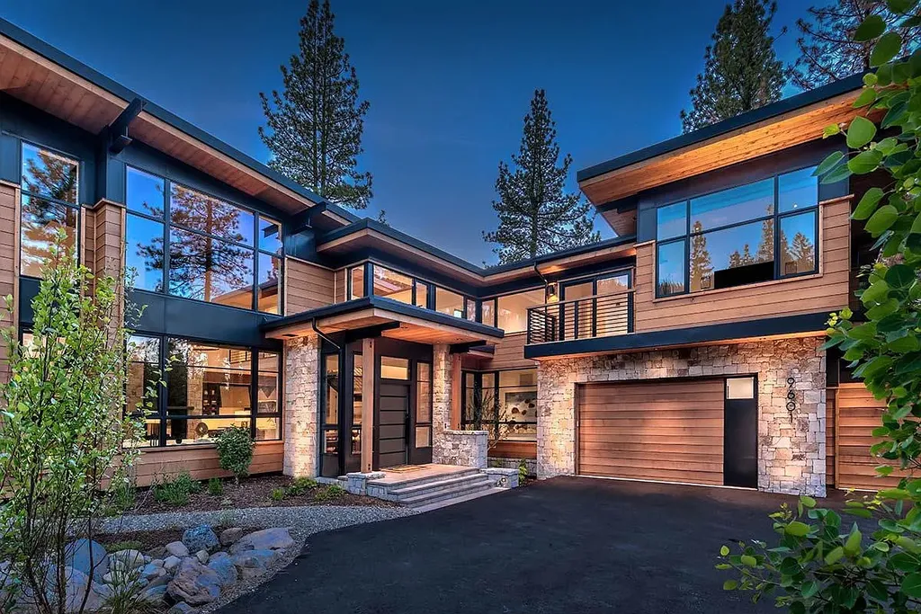 9601 Dunsmuir Way Home in Truckee, California. Immerse yourself in the tranquility of this exquisite Martis Camp home, boasting panoramic mountain views and luxurious amenities. Wake up to breathtaking sunrises, enjoy the open great room with its stunning architecture, and indulge in the state-of-the-art kitchen and spacious living areas. With five bedrooms, a hot tub patio, and proximity to skiing and tennis facilities, this retreat offers a perfect balance of serenity and convenience. Experience mountain living at its finest in this stylishly designed home nestled amidst the natural beauty of Martis Camp.