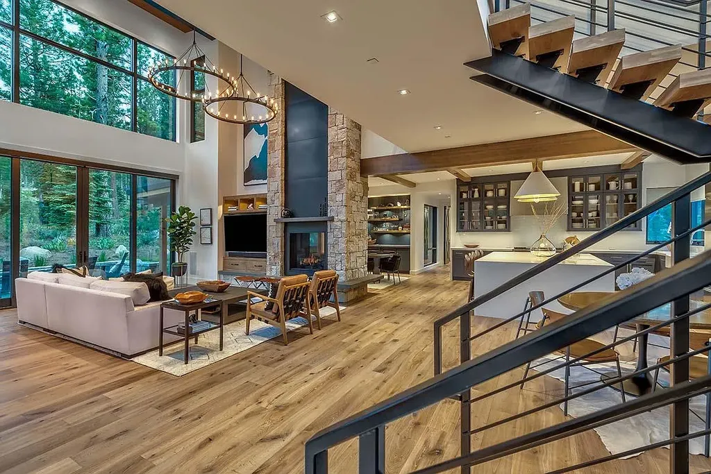 9601 Dunsmuir Way Home in Truckee, California. Immerse yourself in the tranquility of this exquisite Martis Camp home, boasting panoramic mountain views and luxurious amenities. Wake up to breathtaking sunrises, enjoy the open great room with its stunning architecture, and indulge in the state-of-the-art kitchen and spacious living areas. With five bedrooms, a hot tub patio, and proximity to skiing and tennis facilities, this retreat offers a perfect balance of serenity and convenience. Experience mountain living at its finest in this stylishly designed home nestled amidst the natural beauty of Martis Camp.